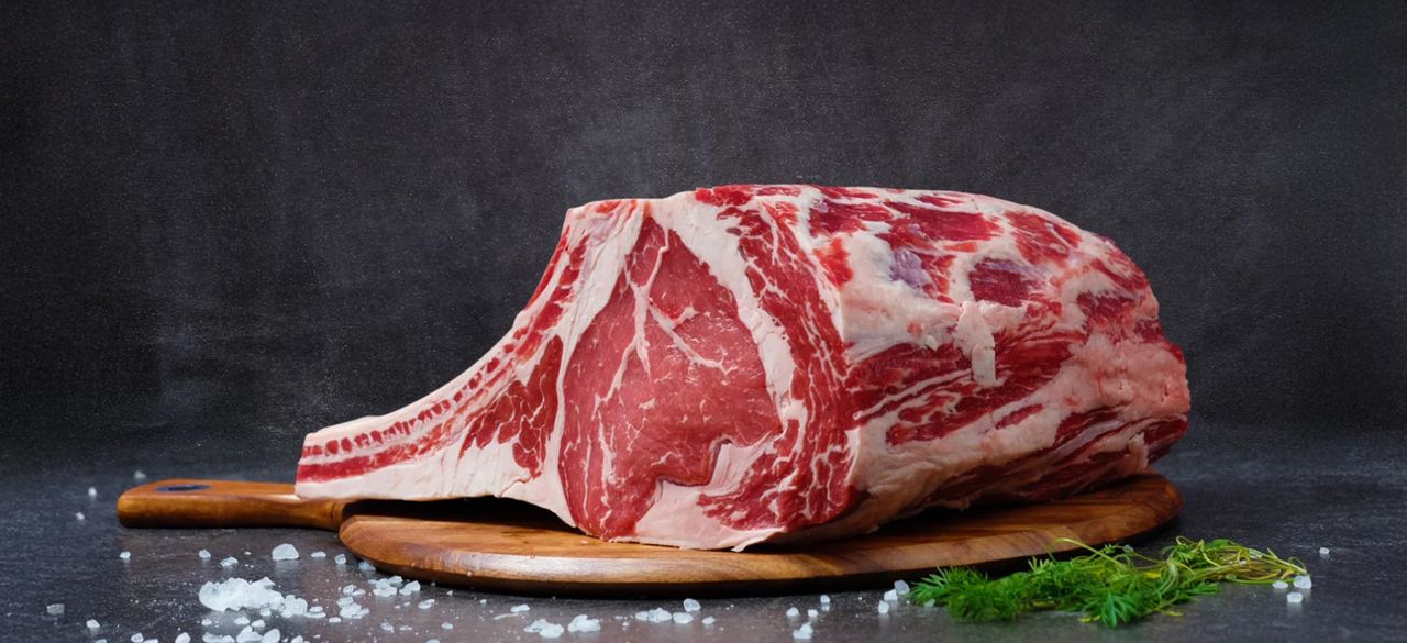 The Art of Drawing Readers In: Your attractive post title goes here High-quality raw ribeye beef on a wooden board, perfect for gourmet cooking.